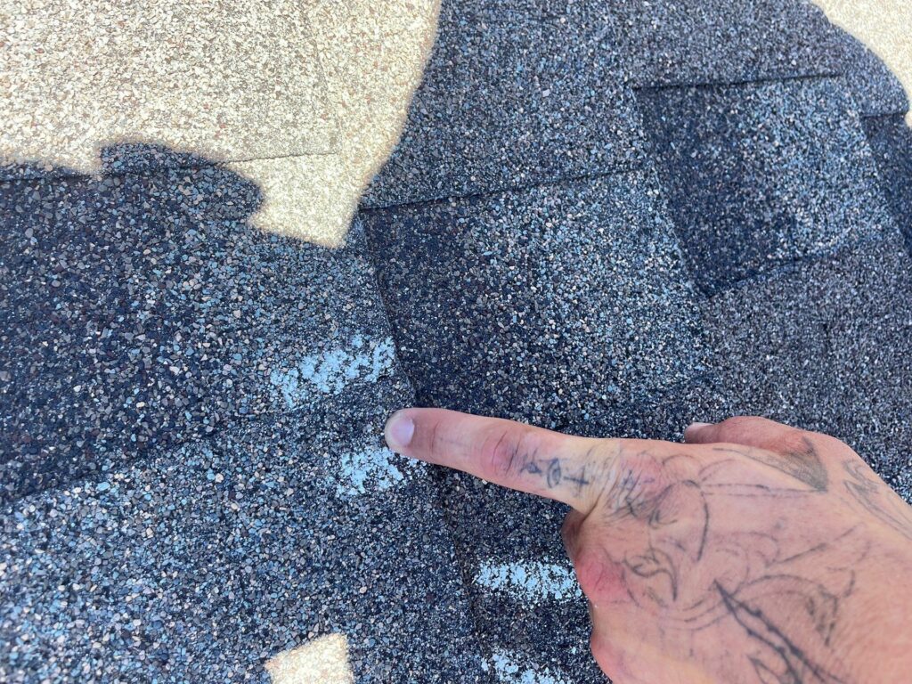 hail-damage-on-asphalt-shingle-roof-in-Bonham-Dr-Hewitt-TX-76643-by-Legacy-Roofing-Pros-roof-inspection-1