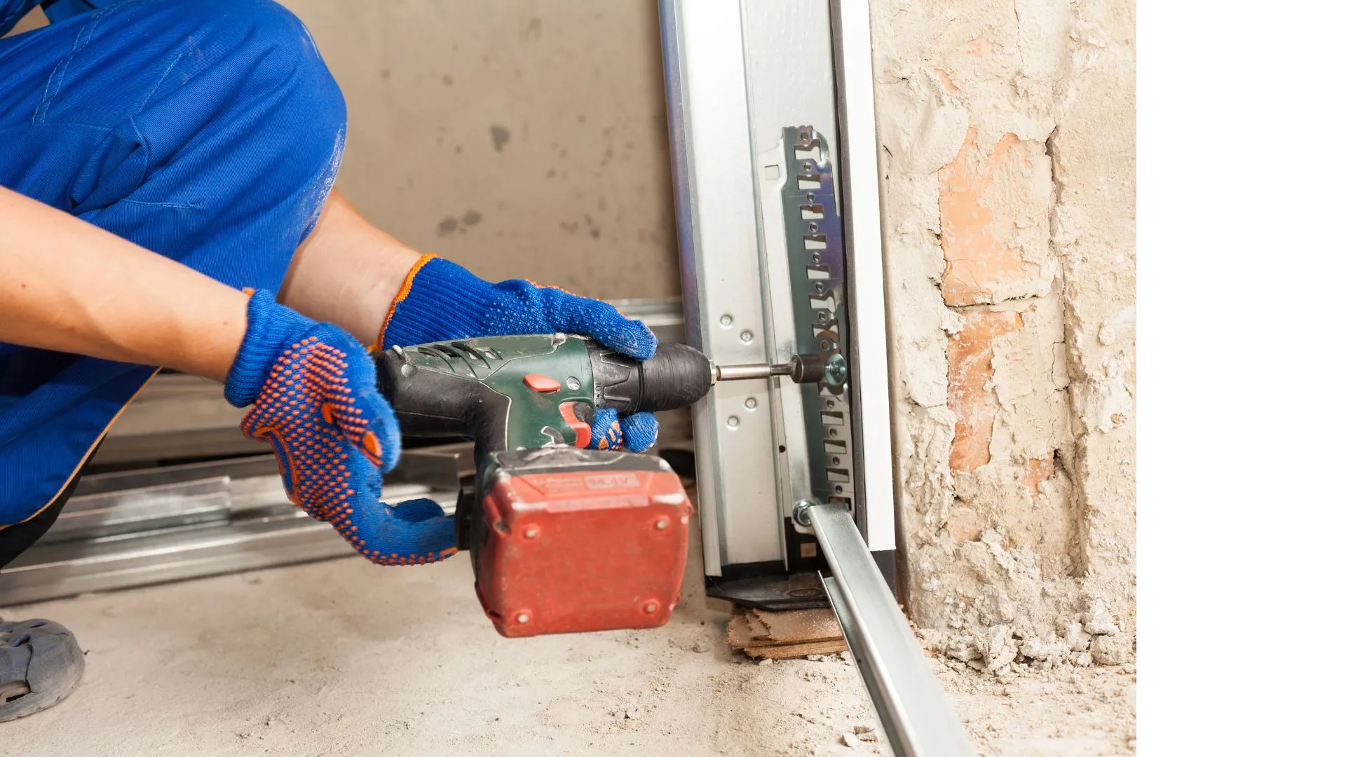 Technician repairing a garage door