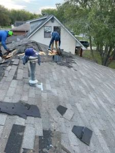 dismantling-old-3-tab-shingles-for-roof-replacement-in-Ward-St-Lockhart-TX-78644-by-Legacy-Roofing-Pros