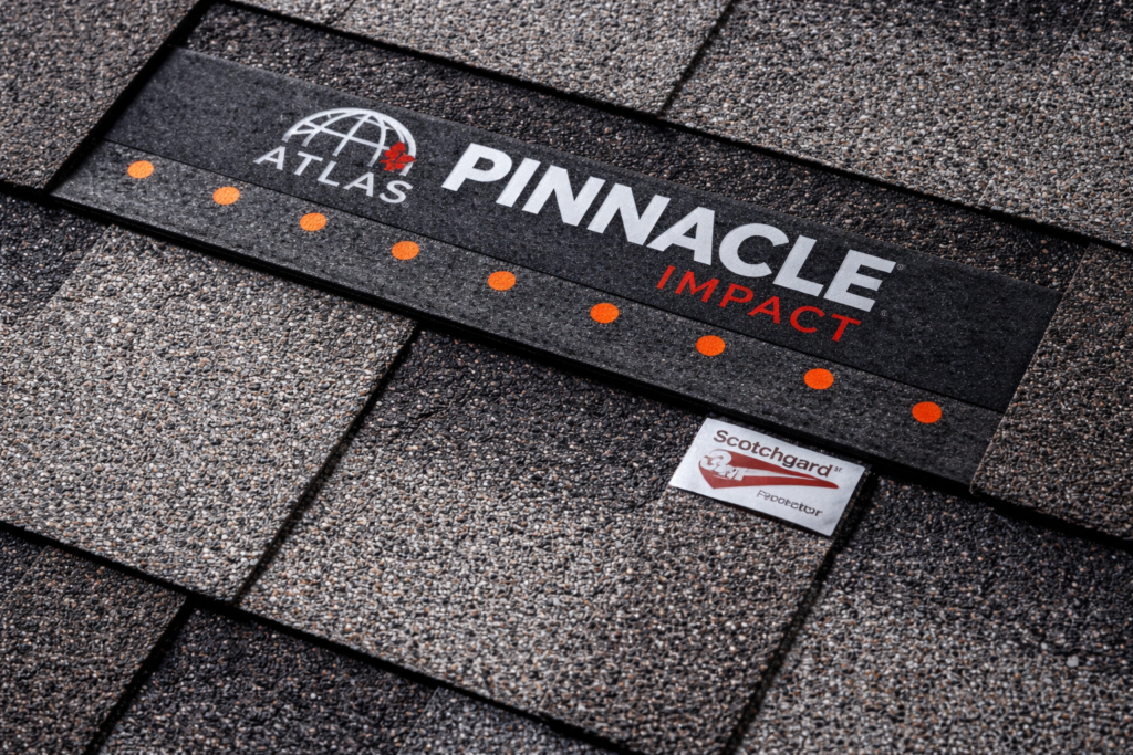 close-up view of asphalt roof shingles showing granule texture and layered pattern