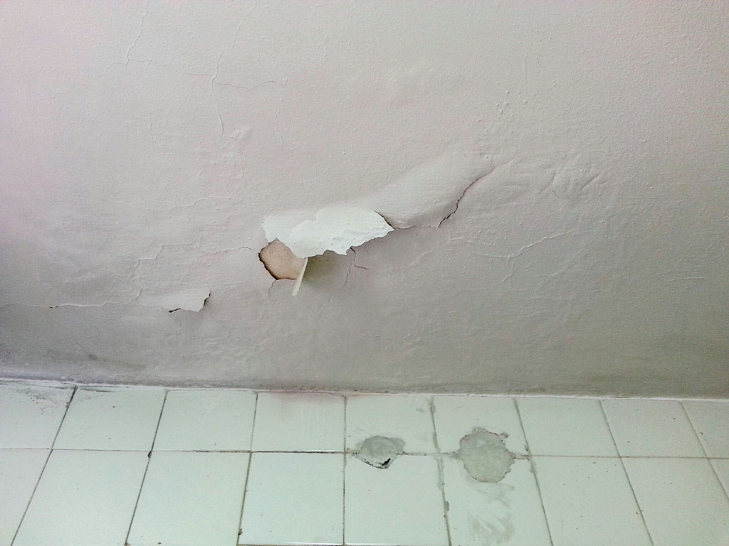 Interior wall with peeling paint from moisture
