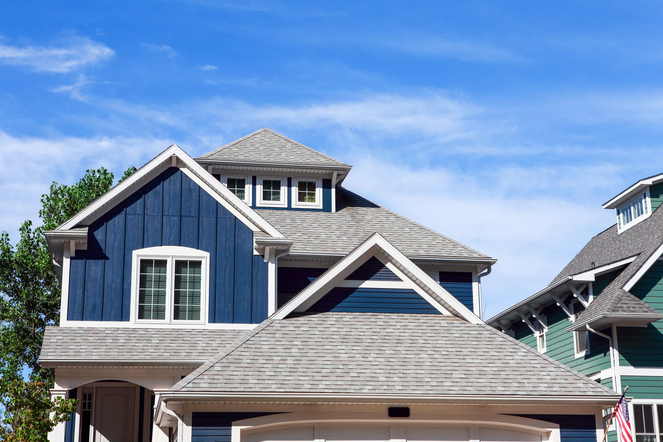Asphalt shingle roof on blue beach houses