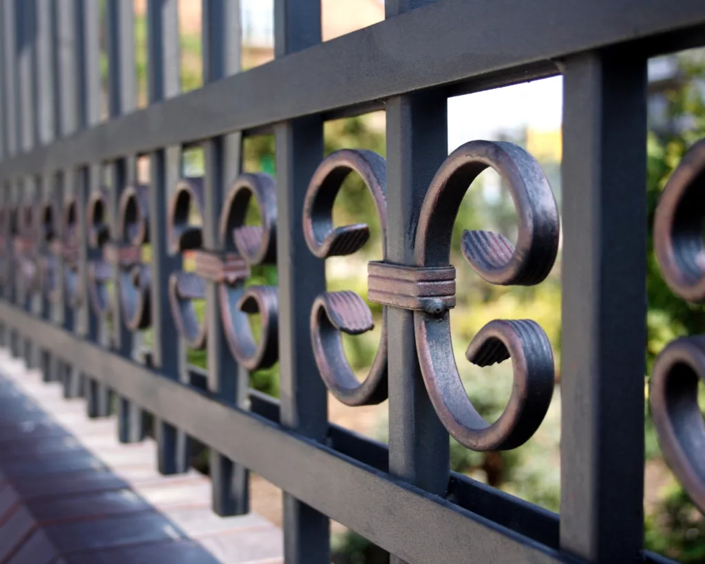 Close up of design on wrought-iron fence