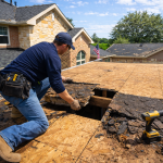 Roof decking replacement in Texas with contractor inspecting and replacing damaged plywood decking during roof replacement