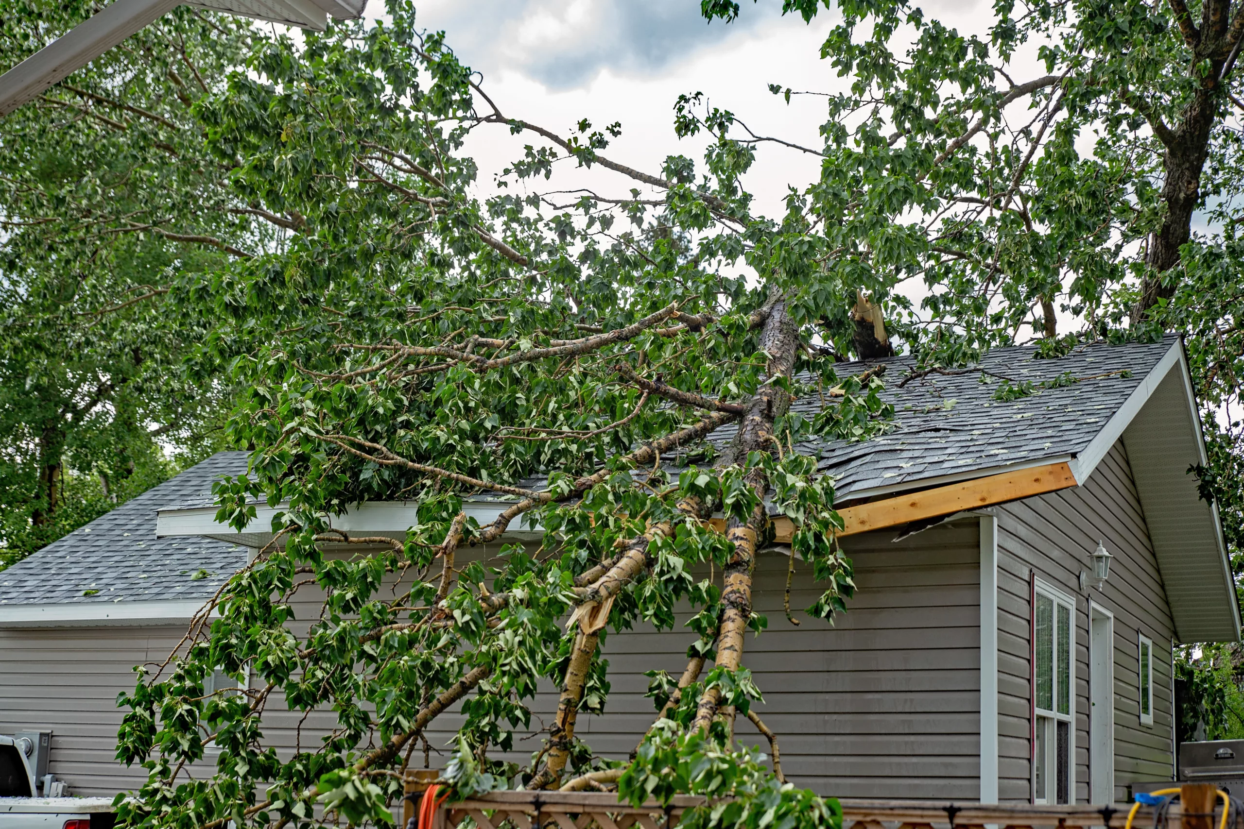 Roof damage to a house after a storm
