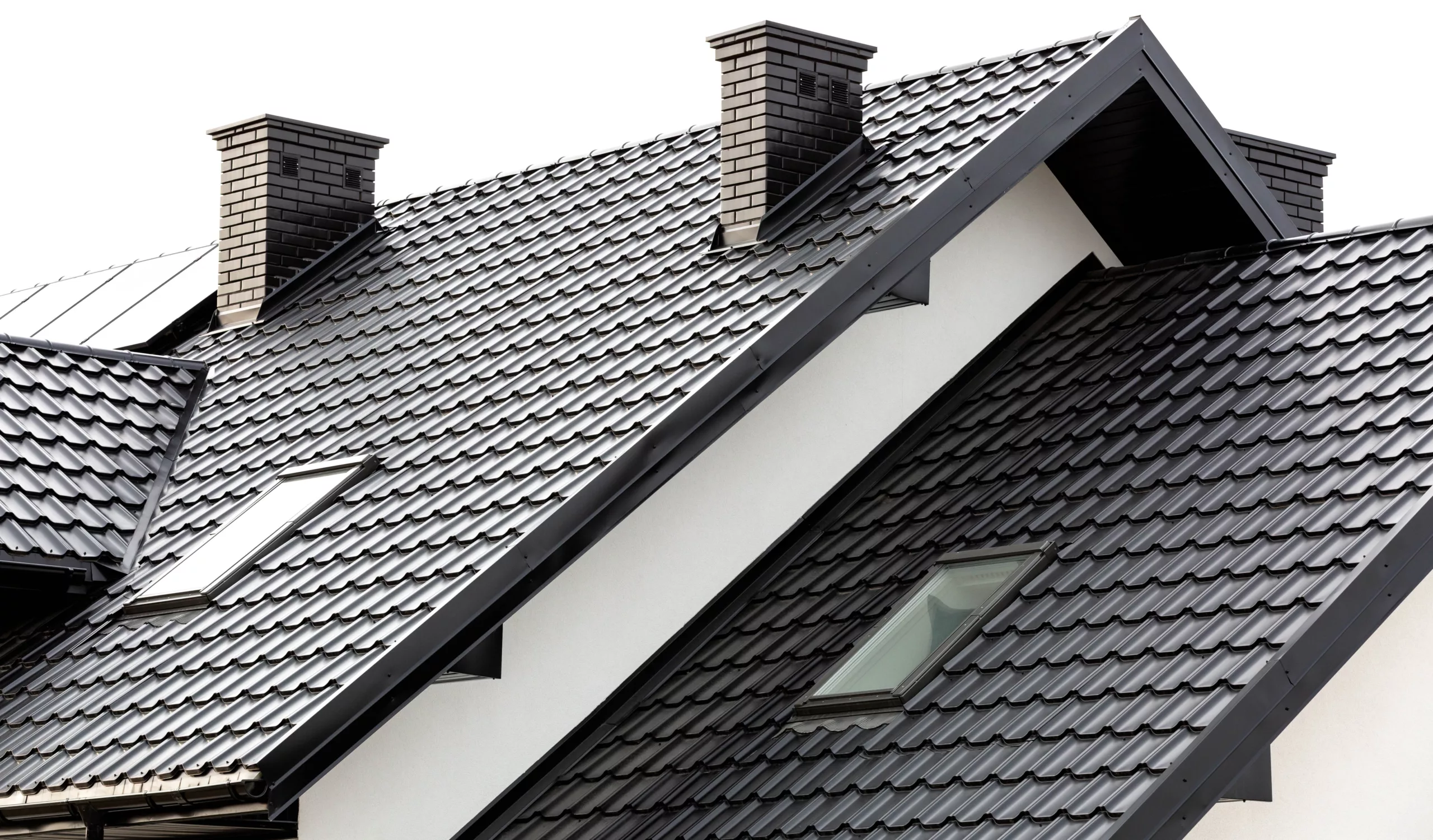 Black metal roof with skylights and two chimneys