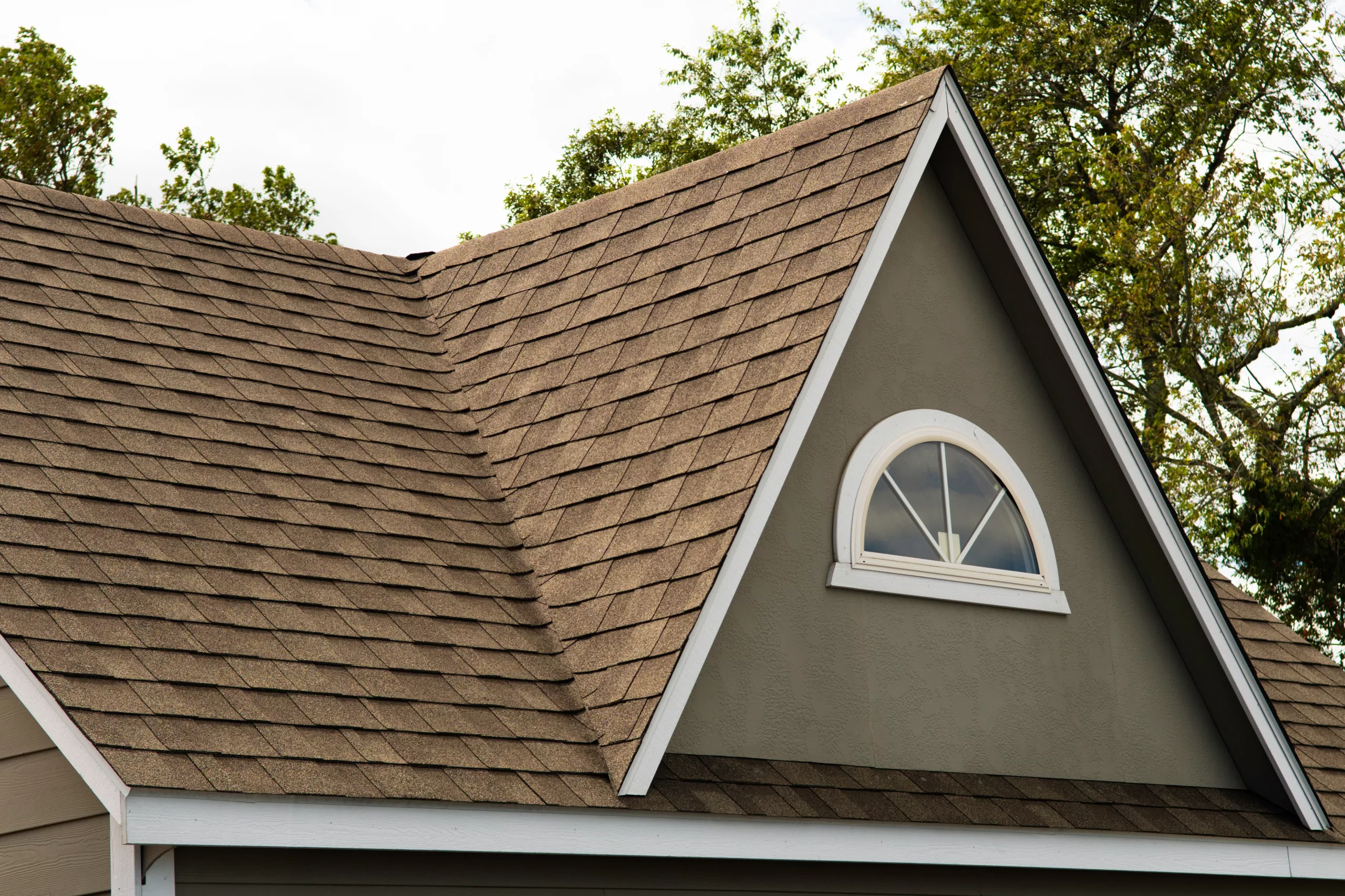 Shingle roof on a brown house