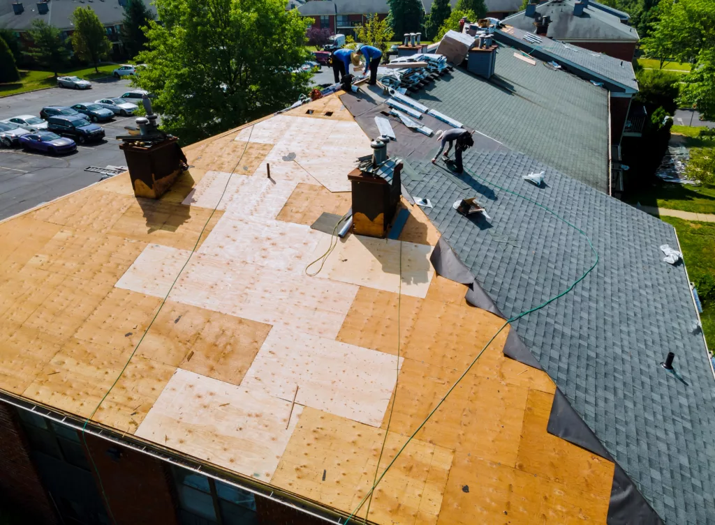Workers replacing a residential roof