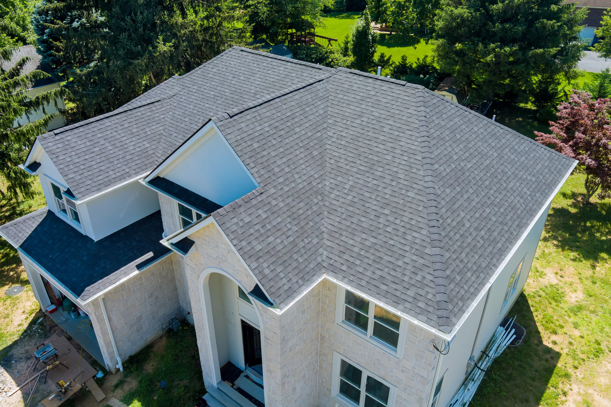 Aerial view of asphalt shingle roof on a two-story house