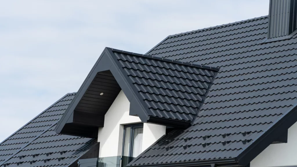 Close-up of residence with black metal roofing panels
