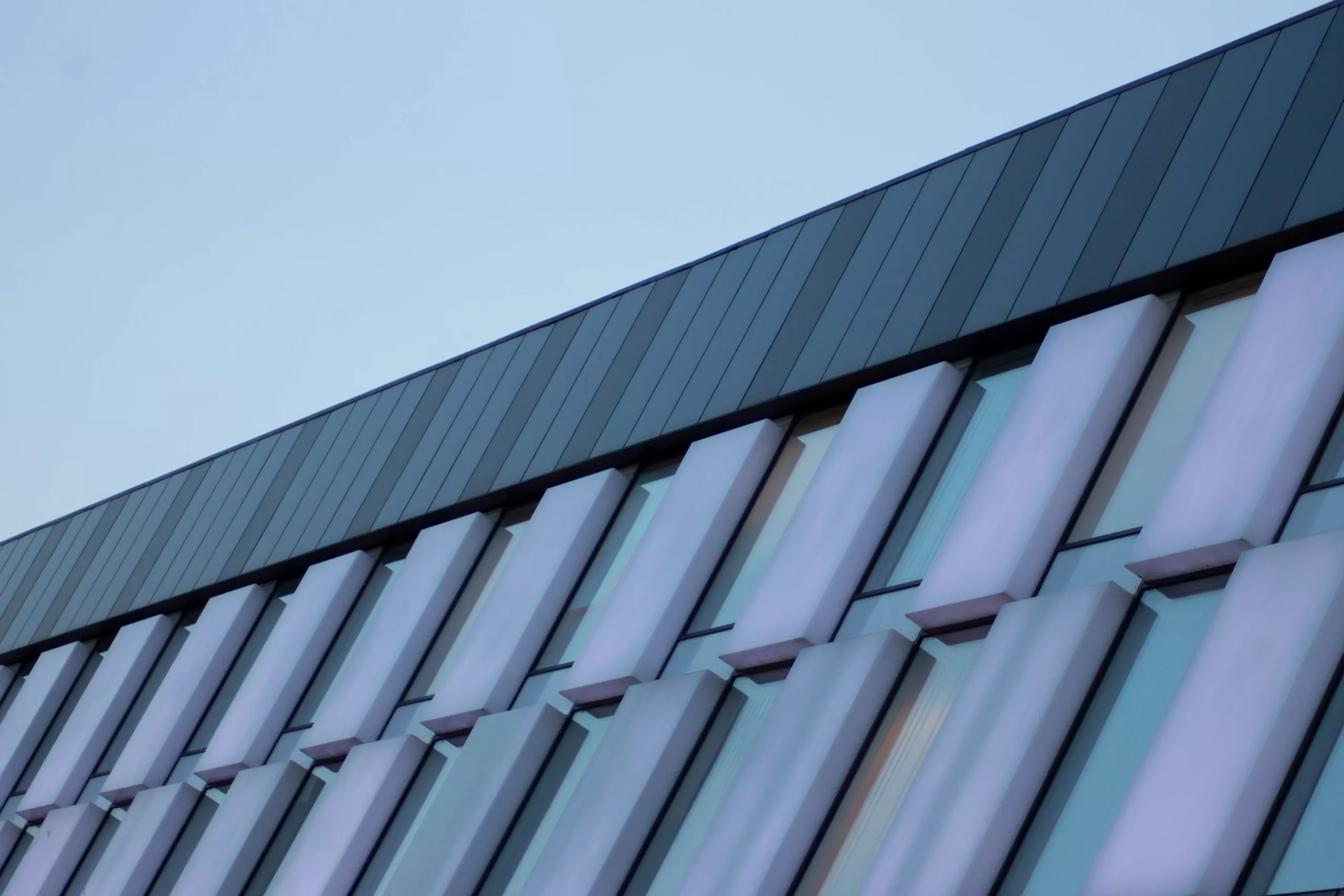 An impressive commercial roof is shown with a few different roofing materials making it look professional and stylish