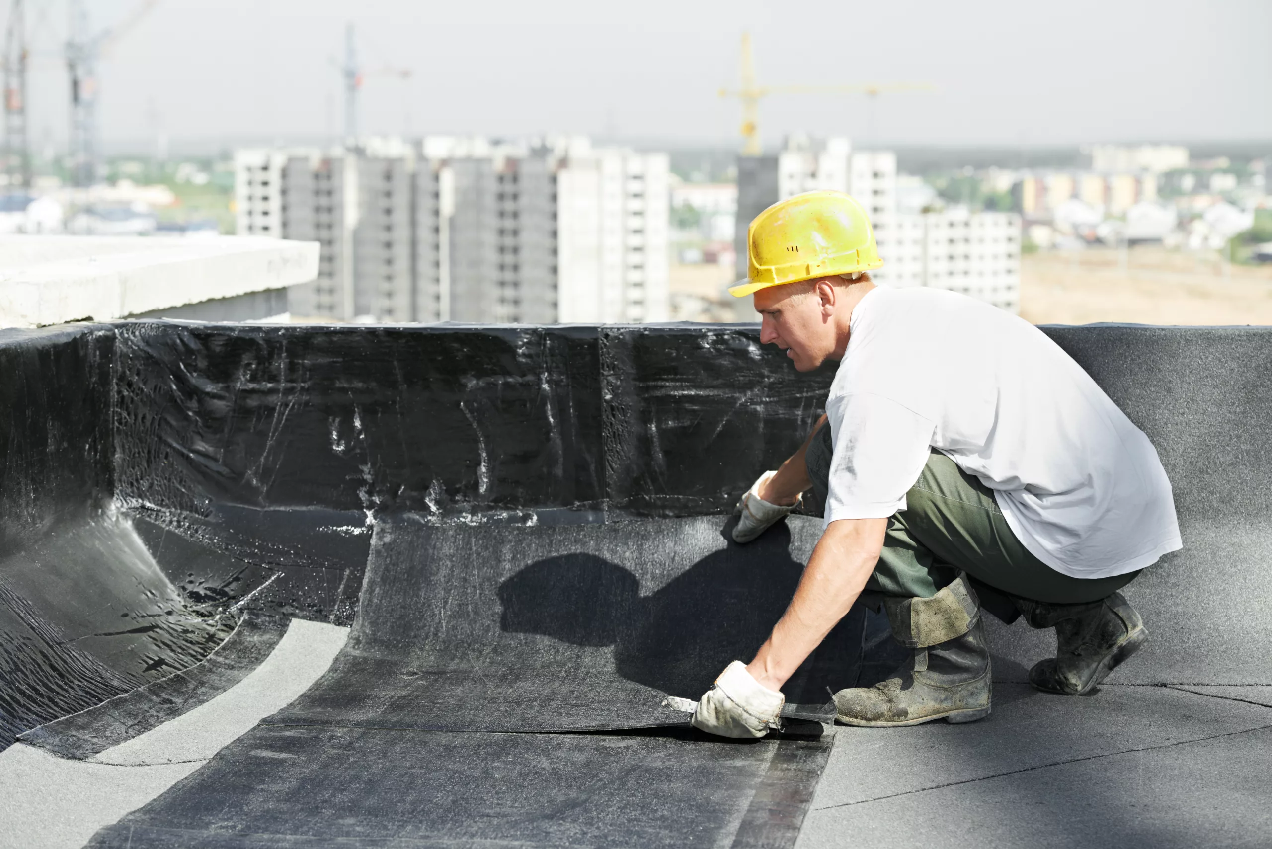 Roofer replacing a flat roof
