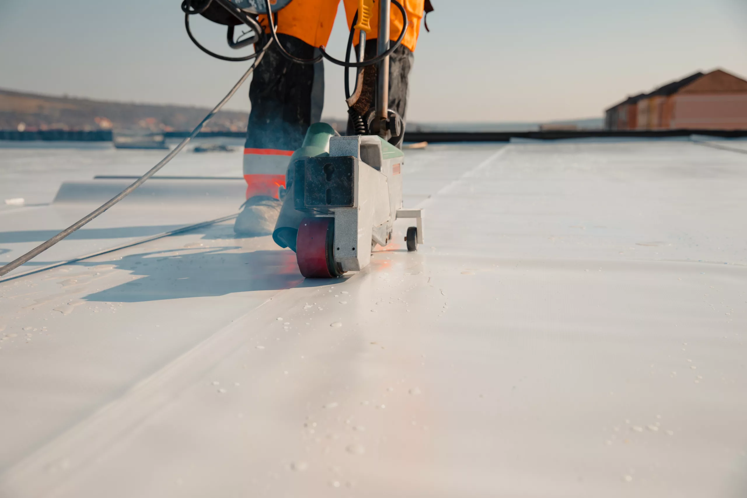 Roofer replacing a flat roof