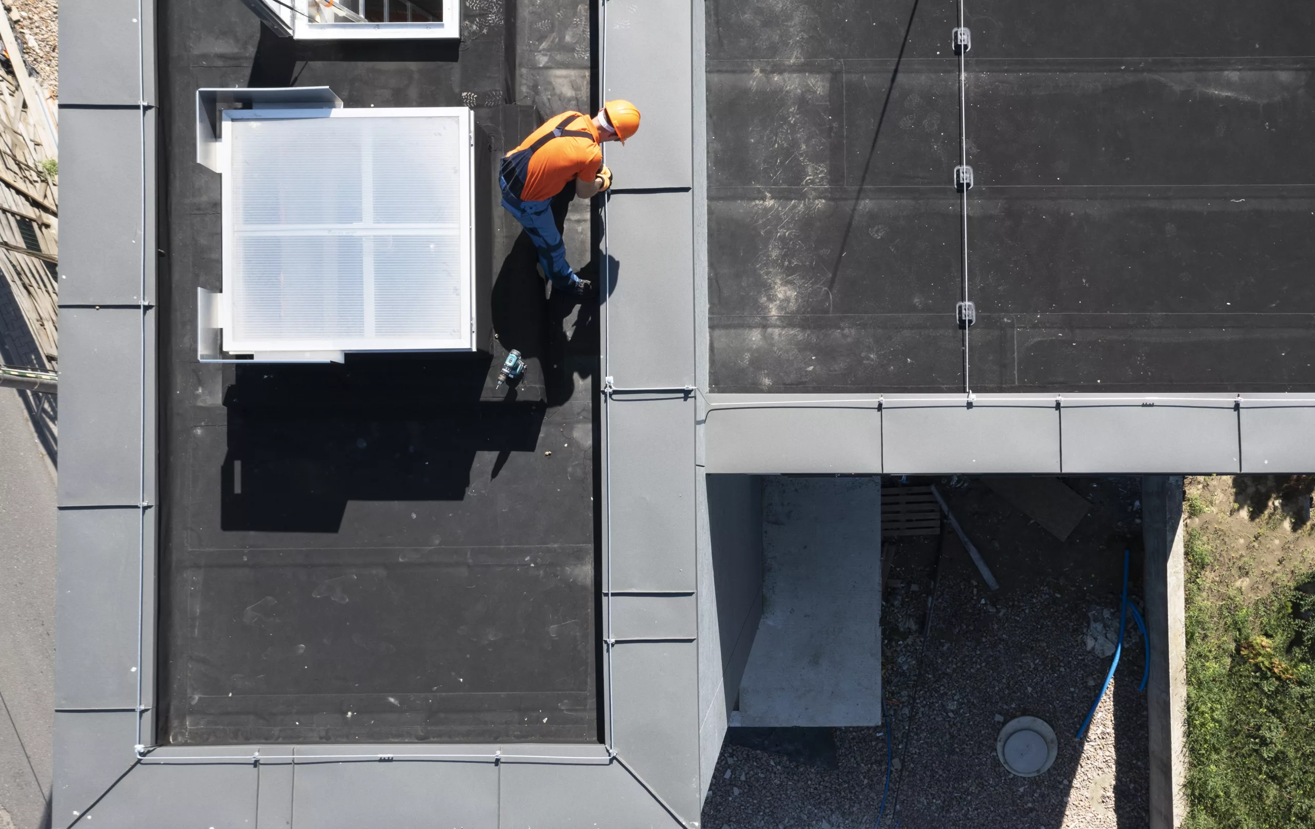 Worker repairing a flat roof