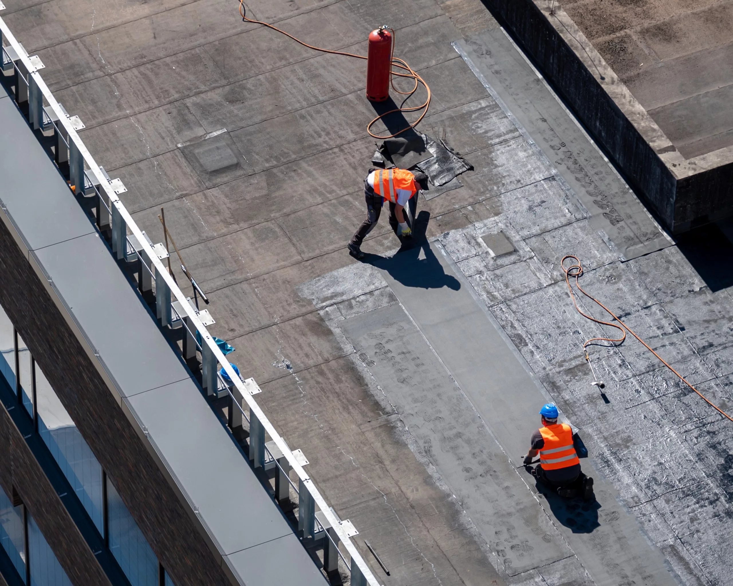 Applying membrane repair on a flat roof