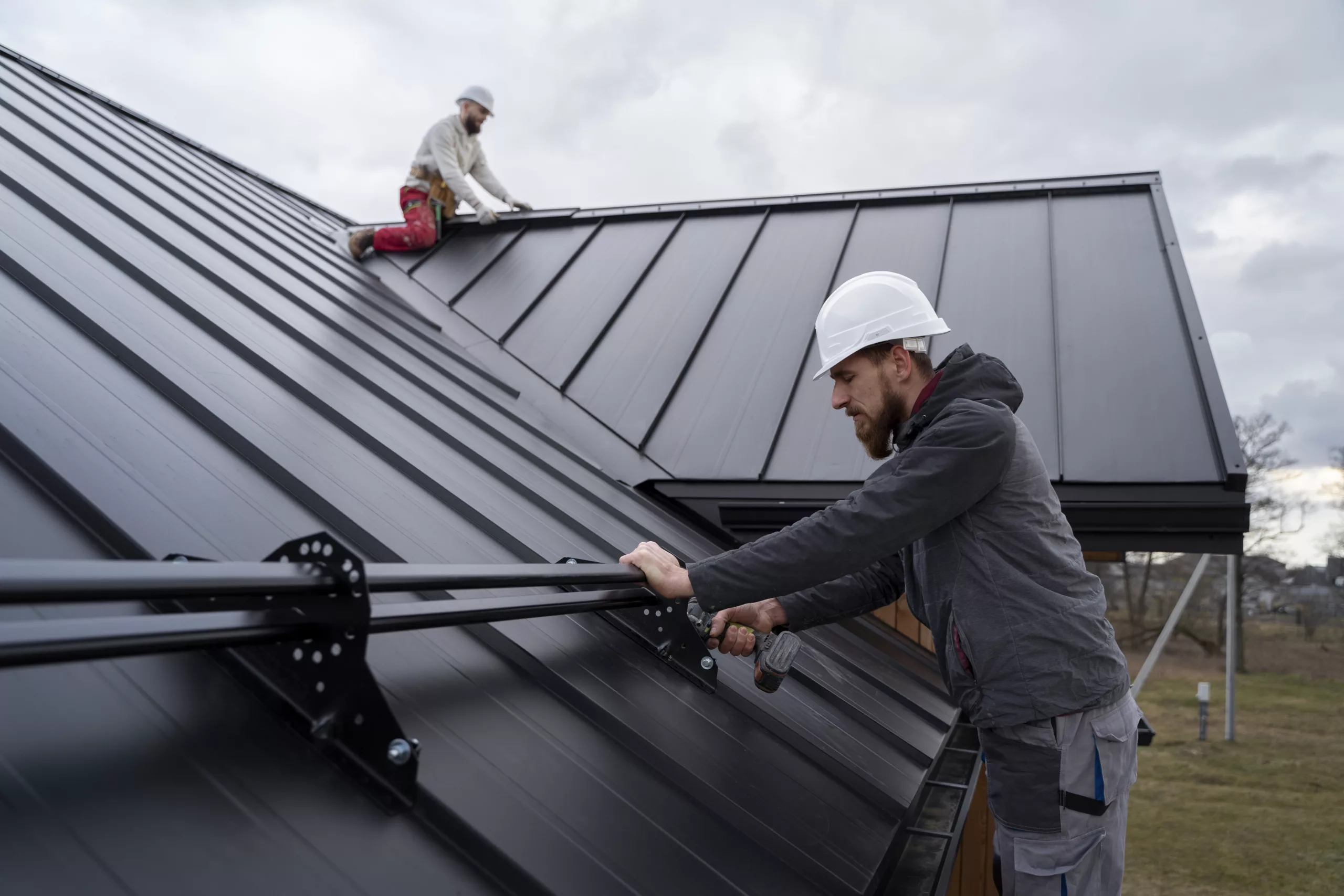 This photo shows a roofer on a commercial roof.