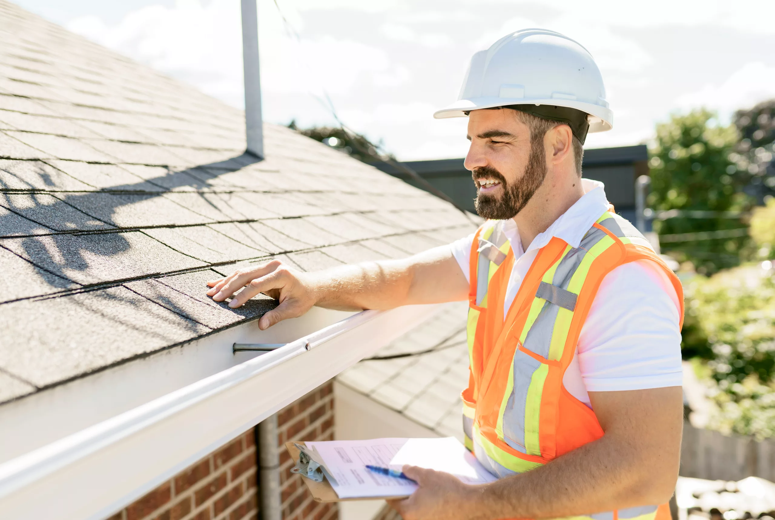 Inspector examining a residential roof