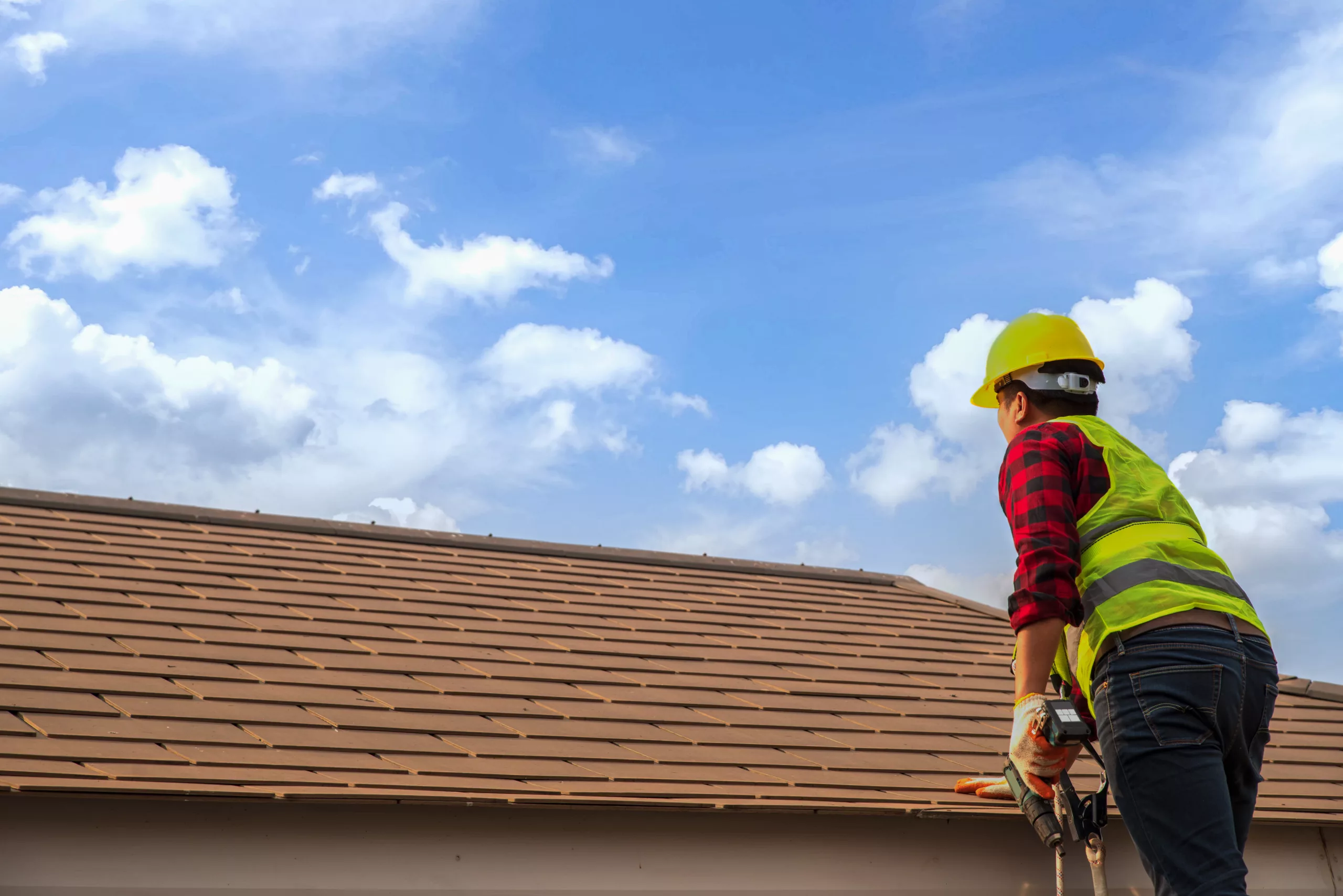 Inspector inspecting a residential roof