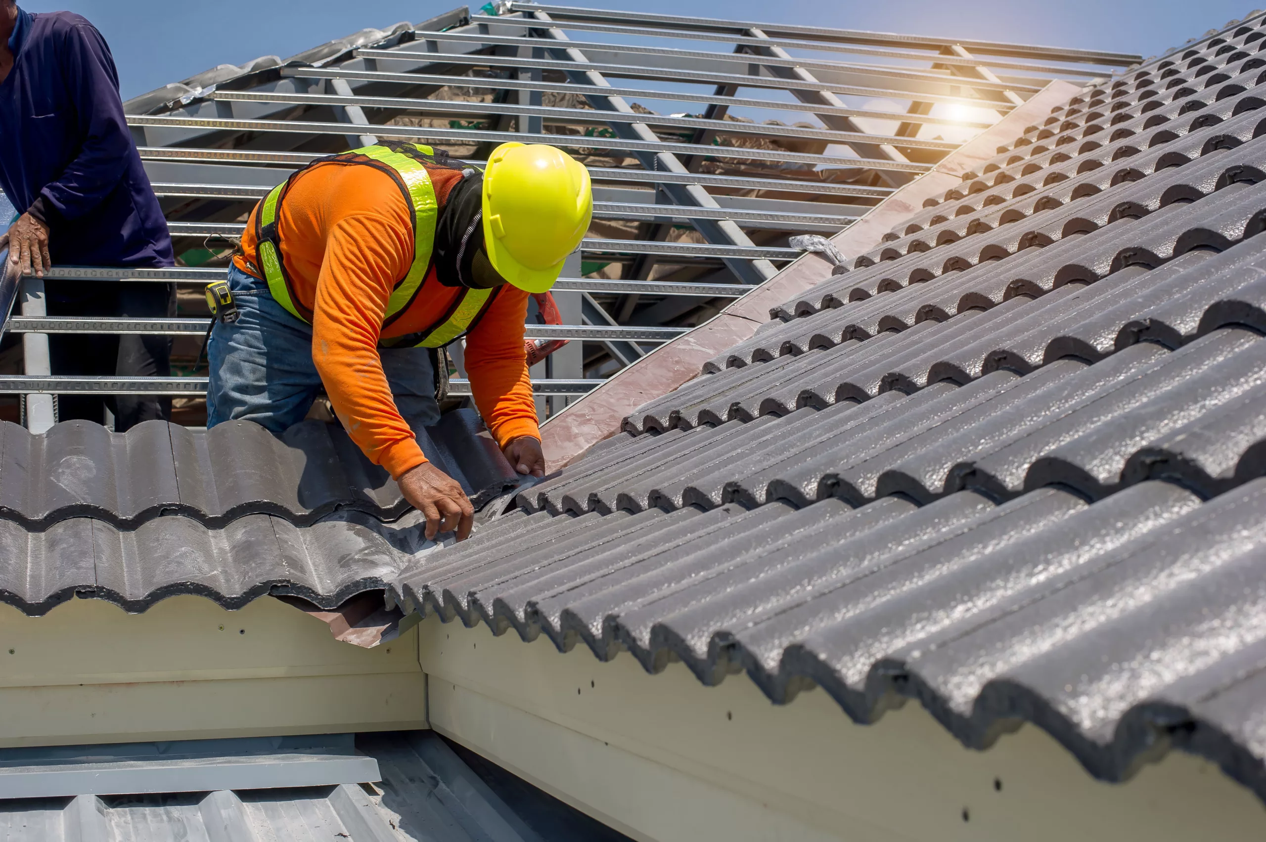 Roofers installing a tile roof