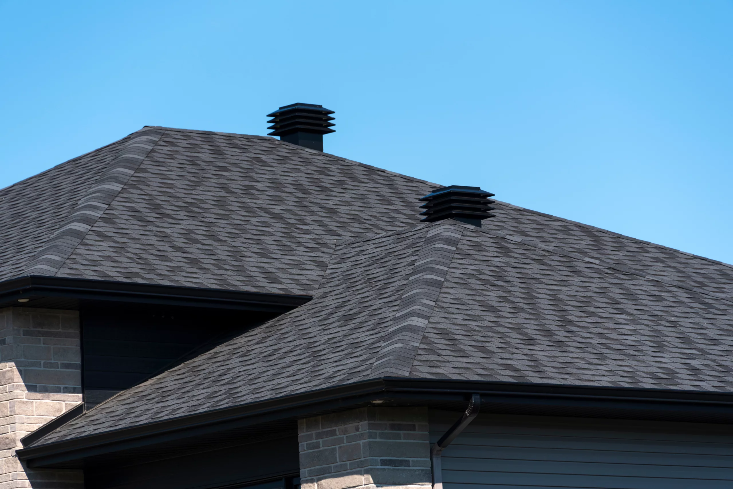 Shingle roof on a brick house